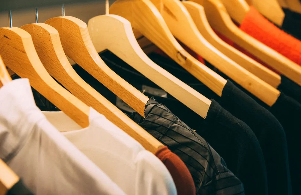 Clothing on hangers, illustrating retail businesses exploring ChatGPT ads.