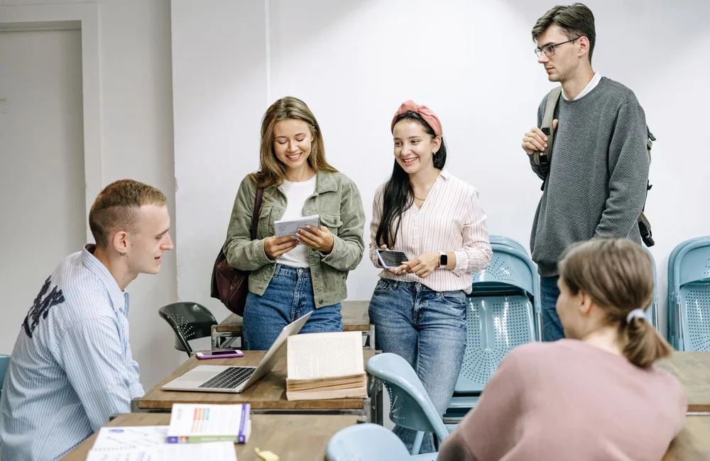 Adults studying together around a table