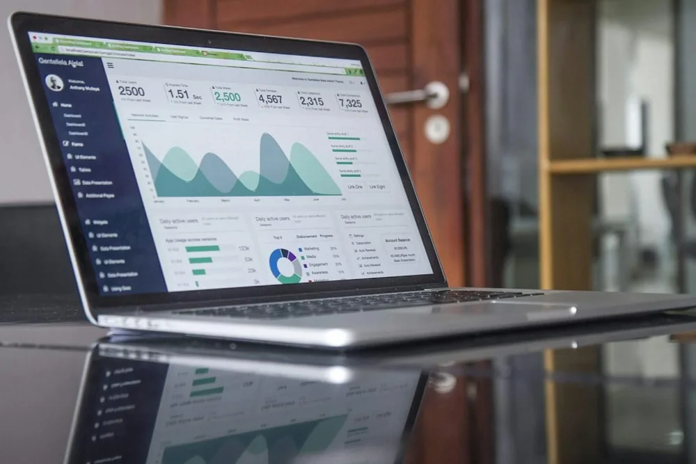 Laptop displaying an analytics dashboard, illustrating software businesses exploring ChatGPT advertising.